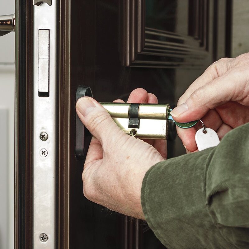 Locksmith replacing a cylinder lock Locksmith replacing a cylinder lock